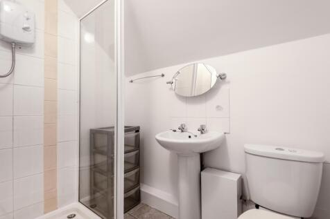A clean and well-maintained bathroom featuring ...
