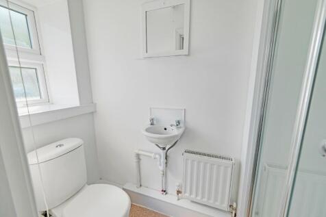 Bright and fresh bathroom featuring a clean whi...