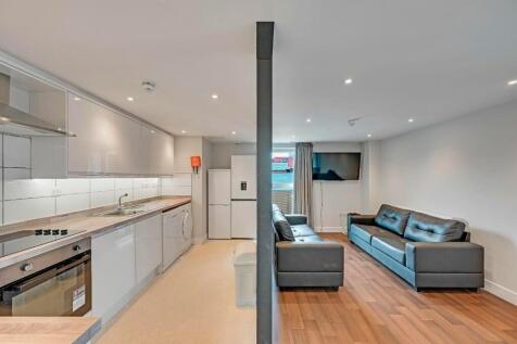 A modern and inviting open-plan living area fea...