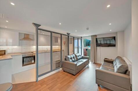 A modern and inviting living room featuring com...