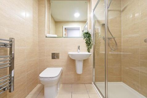 Modern, well-maintained bathroom featuring a sp...