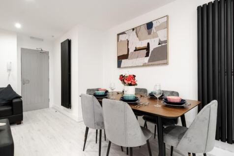 Spacious communal lounge designed for relaxatio...