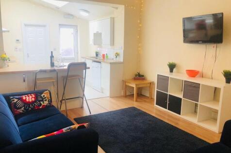 Bright and welcoming living room featuring a co...