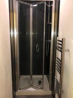 Compact modern shower enclosure with sparkling ...