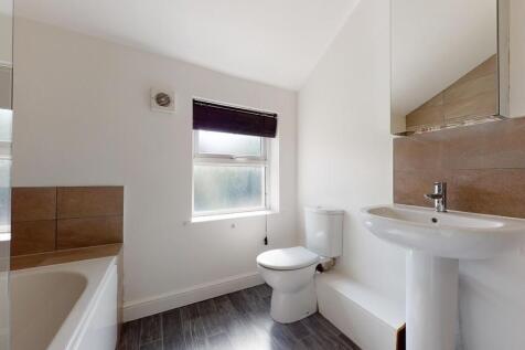 Bright and clean bathroom featuring a full bath...