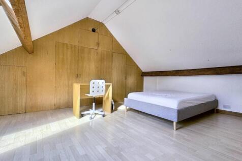 Bright and airy double bedroom featuring a clea...