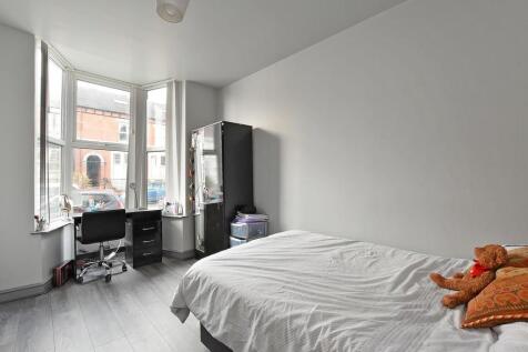 Bright double bedroom featuring a large bay win...