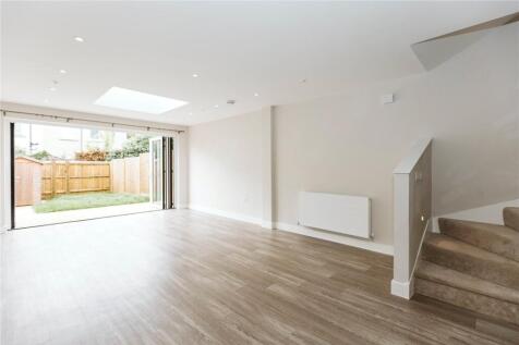 Bright, spacious contemporary living room featu...