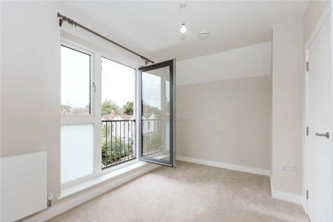Bright and airy master bedroom featuring large ...