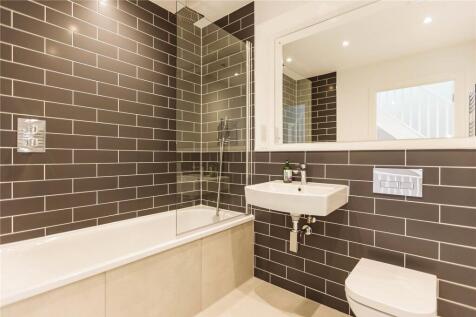 A modern and well-maintained bathroom suite fea...