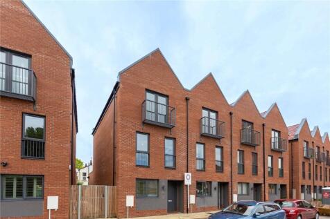 Modern terraced houses with striking angular ro...