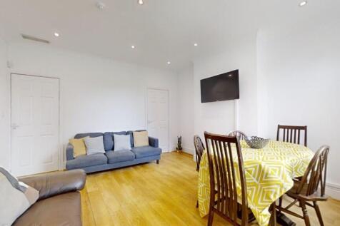 Bright and welcoming living room featuring comf...