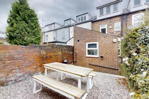 A private and well-maintained garden area featu...