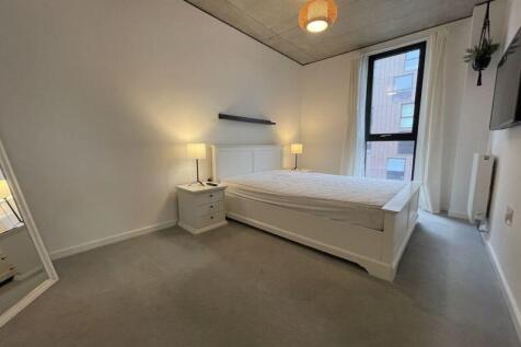 Bright and tidy double bedroom featuring a comf...