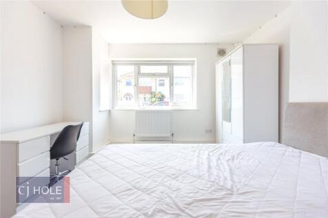 Bright and spacious master bedroom featuring a ...