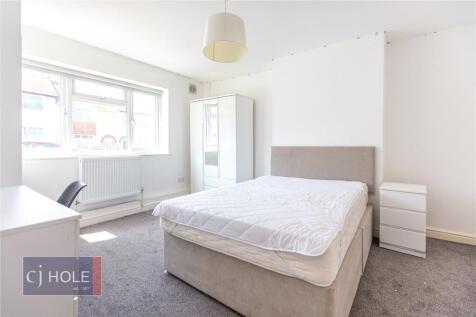 Bright and airy double bedroom featuring a larg...