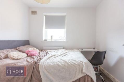 A cozy double bedroom featuring a comfortable d...