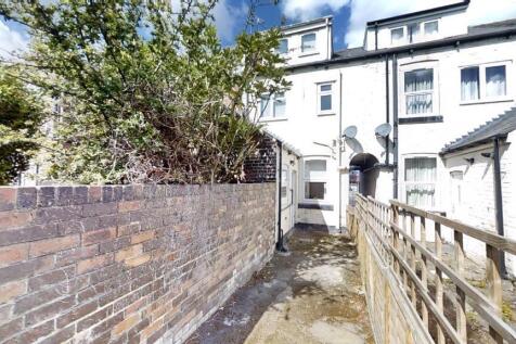 Charming terraced house exterior with natural l...