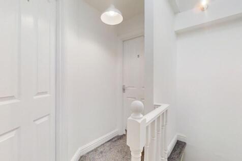Bright and clean hallway with fresh white walls...