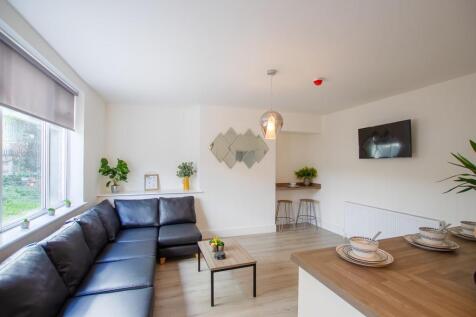 Bright and inviting living room featuring a spa...