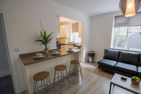 A modern living room featuring a comfortable bl...