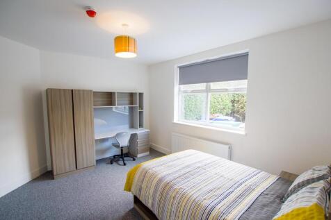 A bright and neatly arranged double bedroom fea...