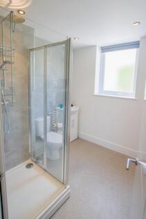 Bright and clean modern bathroom featuring a sp...