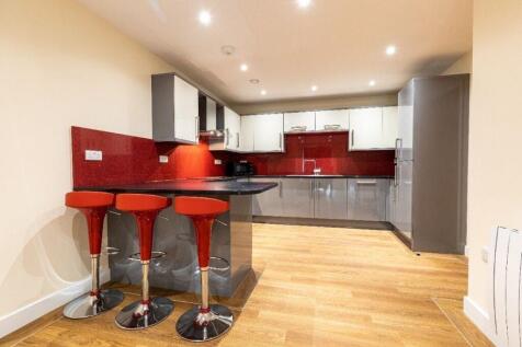 A modern kitchen with ample countertop space an...