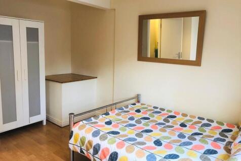 A bright and welcoming double bedroom featuring...