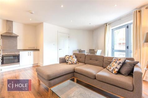 Bright and modern living room with a spacious L...