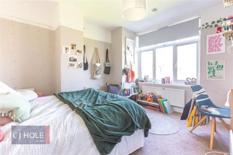 Bright and cozy double bedroom featuring a comf...