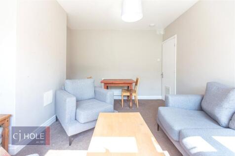 Bright and inviting living room featuring comfo...