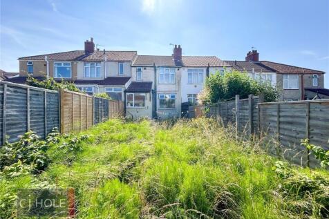 A spacious backyard garden with abundant natura...