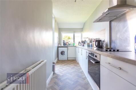 A modern, well-maintained kitchen with ample na...