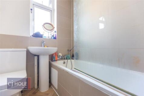 Bright and clean bathroom featuring a modern ba...