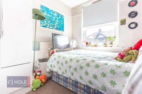 Bright and cozy single bedroom featuring a larg...