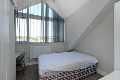 Bright and cozy double bedroom featuring a larg...