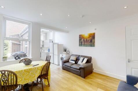 A bright and welcoming living room featuring a ...