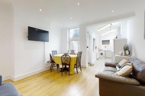 Bright and welcoming living room featuring mode...