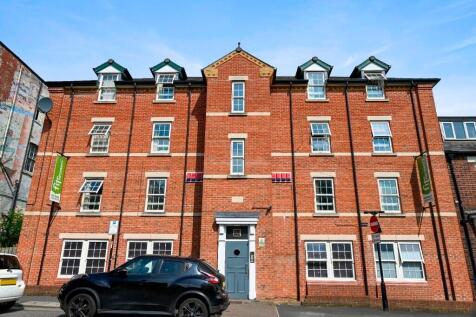 A well-maintained traditional red brick terrace...