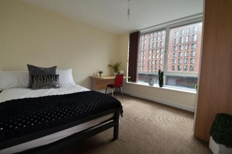 A bright and tidy double bedroom featuring a co...