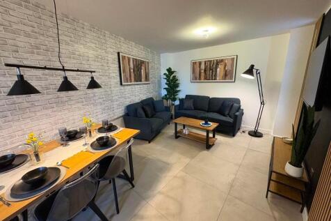 A modern and inviting living room featuring a c...