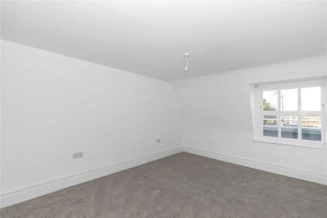 Bright and clean double bedroom featuring neutr...