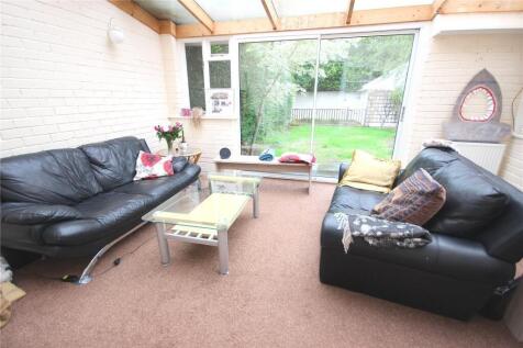 A cozy living room featuring two comfortable bl...