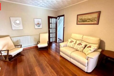 A warm and inviting living room featuring polis...