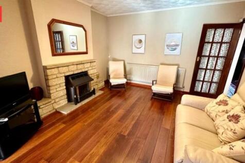 A bright and inviting living room featuring pol...