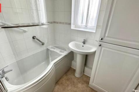 Bright and clean bathroom featuring a modern wh...