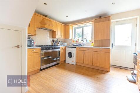 Bright and functional kitchen featuring ample w...
