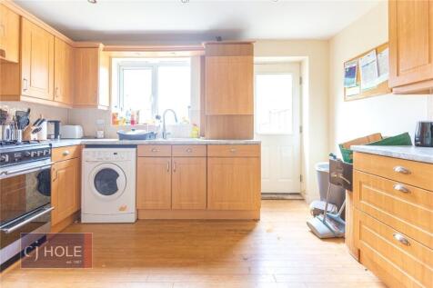 Bright and inviting kitchen with ample natural ...