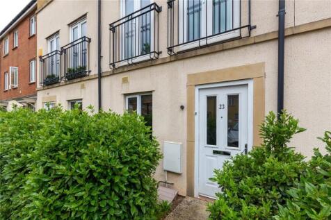 A well-maintained terraced house entrance featu...